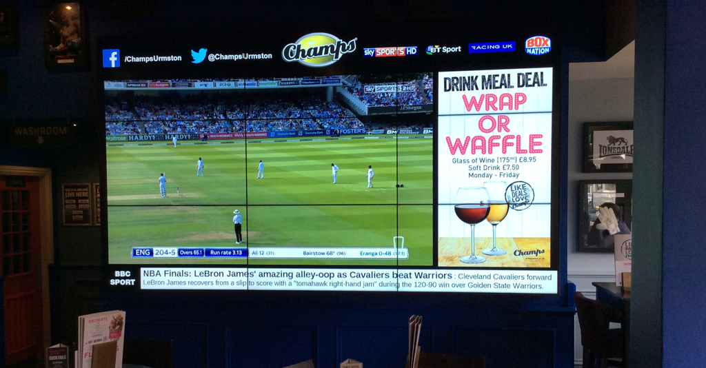 Samsung Video Walls in a bar showing a cricket game