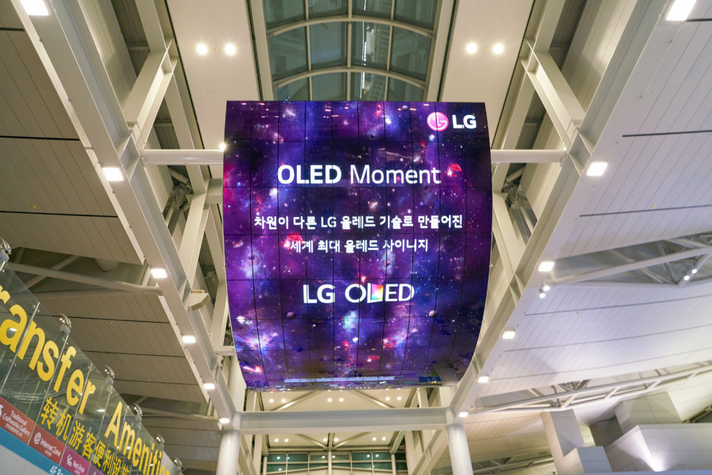 LG OLED Digital Sign in an airport check in area