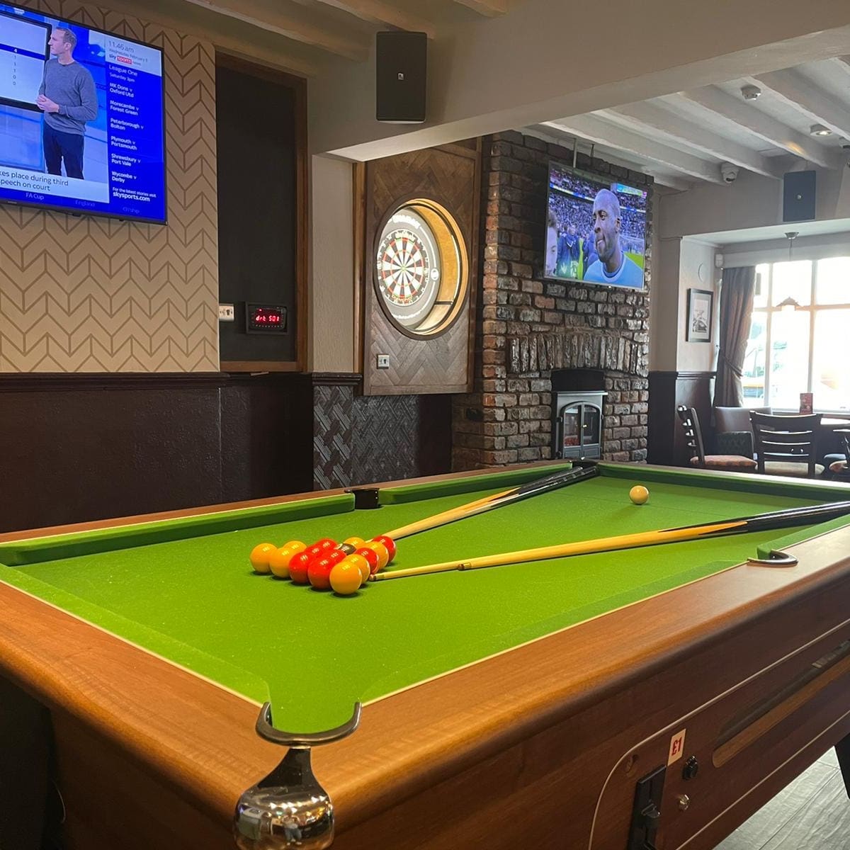 The side bar area in the cross keys pub with a pool table.